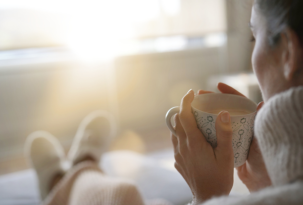 person in a home heated by geothermal heating