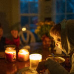 people sitting together in a room without power
