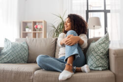 woman sitting comfortably in her home