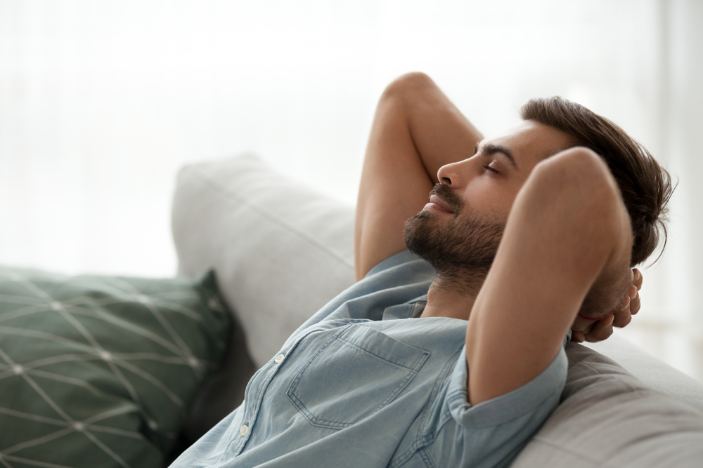 man relaxing in his home
