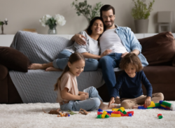 a mom and dad spend time with their two kids after having their air handler replaced in Fort Wayne, IN