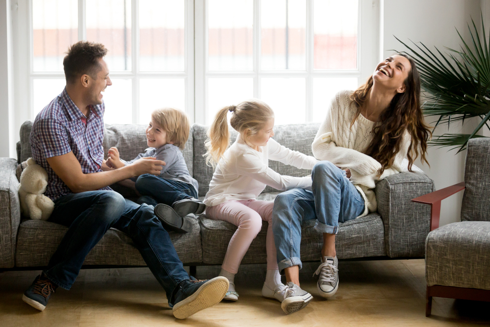 a family spends time together on their couch