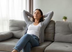 a woman relaxes on her couch after having uv light installed in Fort Wayne, IN