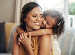 A daugther and mother smiling together while waiting for Heat Pump Maintenance in Huntertown, IN